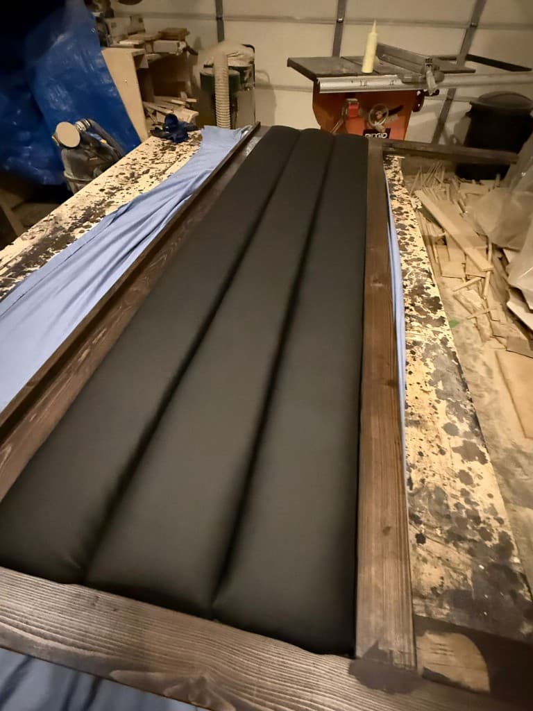 Custom upholstered tufted headboard being built in our Edmonton workshop