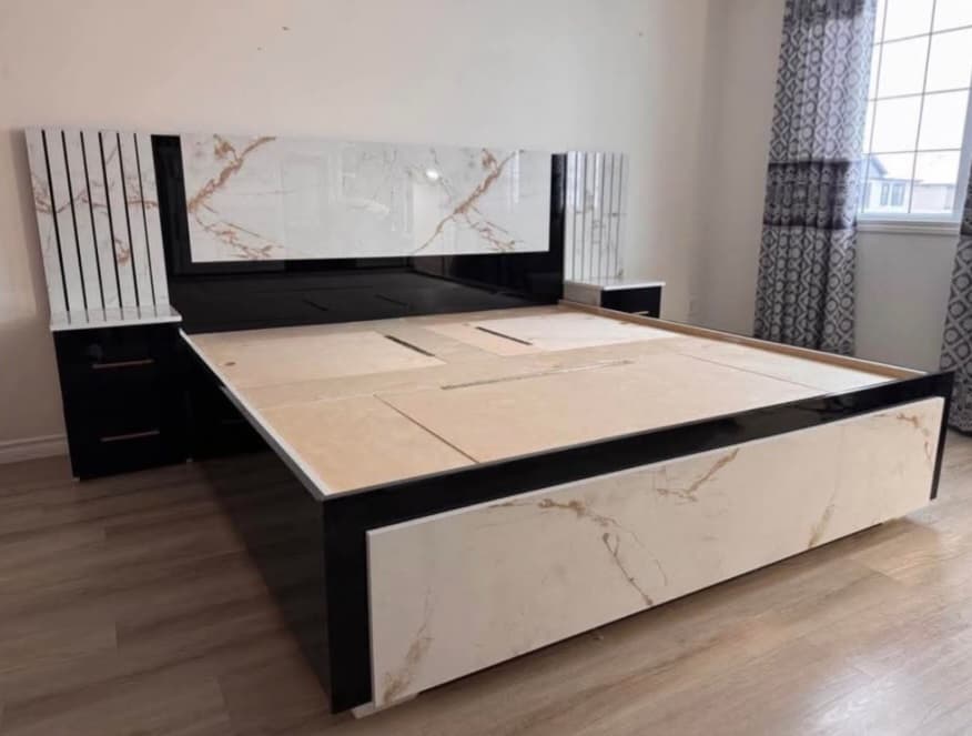 Custom box bed with a luxury marble-look finish and matching mirrored nightstands